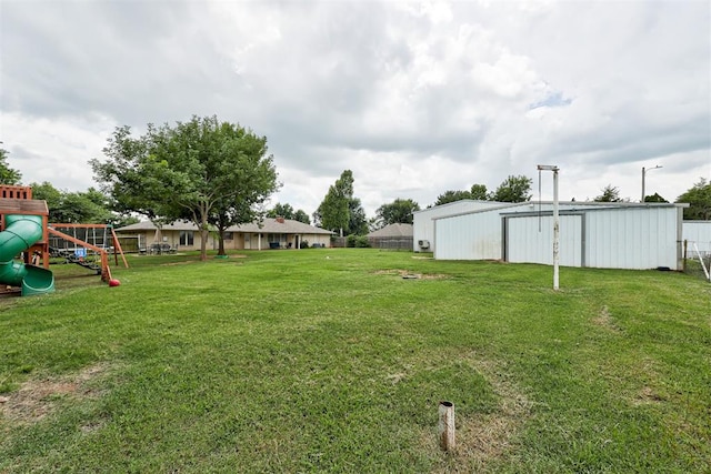 2401 Big Cedar Ave, Edmond, OK 73012 - view of yard with an outbuilding and a playground