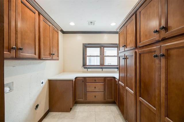 3824 Key Pl, Oklahoma City, OK 73112 - laundry area featuring cabinet space, hookup for an electric dryer, light tile patterned flooring, ornamental molding, and recessed lighting