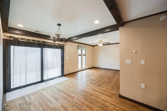 3824 Key Pl, Oklahoma City, OK 73112 - empty room featuring beamed ceiling, light wood-style flooring, a chandelier, a ceiling fan, and a smoke detector