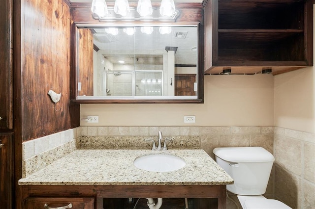 3824 Key Pl, Oklahoma City, OK 73112 - bathroom with vanity and a wainscoted wall