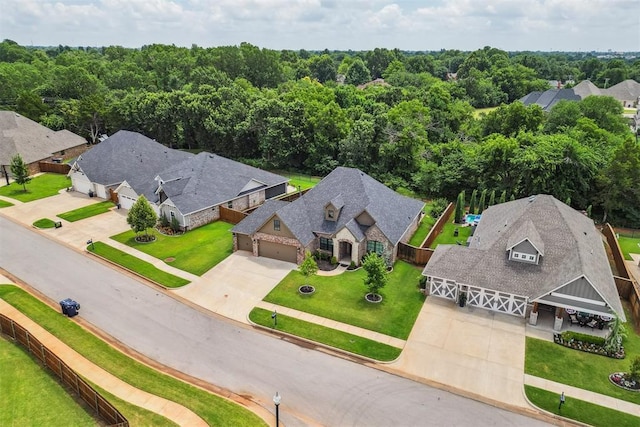 512 NW 186th St, Edmond, OK 73012 - aerial perspective of suburban area with a heavily wooded area