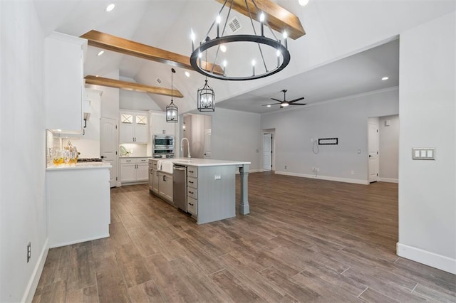 512 NW 186th St, Edmond, OK 73012 - kitchen featuring stainless steel appliances, beam ceiling, a chandelier, white cabinetry, and open floor plan