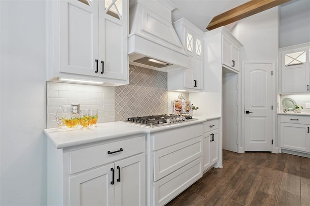 512 NW 186th St, Edmond, OK 73012 - kitchen featuring custom exhaust hood, glass insert cabinets, stainless steel gas cooktop, white cabinets, and light countertops