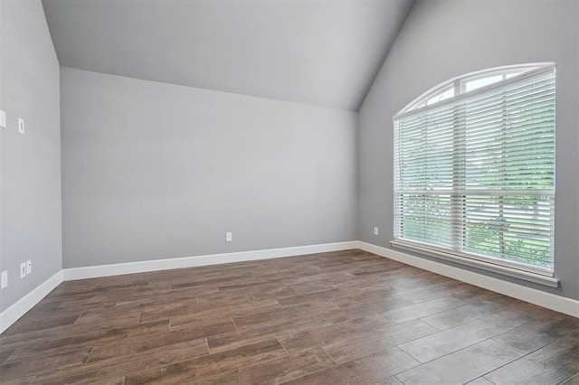 512 NW 186th St, Edmond, OK 73012 - unfurnished room with lofted ceiling and dark wood-type flooring