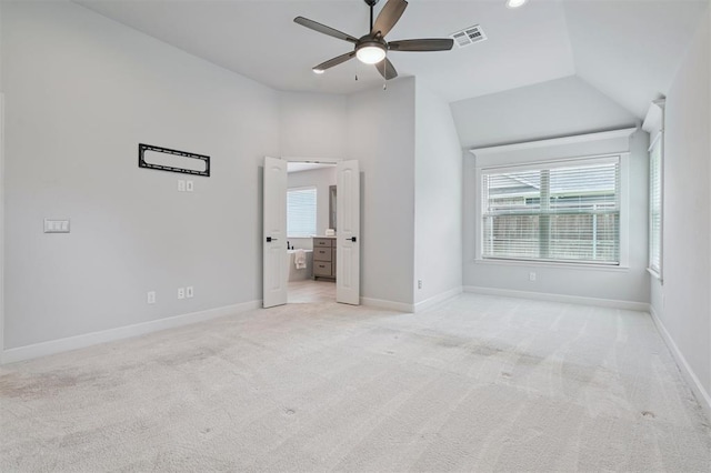 512 NW 186th St, Edmond, OK 73012 - unfurnished bedroom with lofted ceiling, light colored carpet, ceiling fan, and ensuite bath