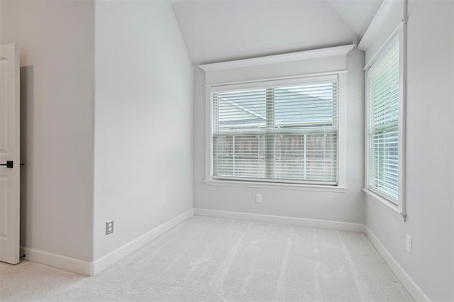 512 NW 186th St, Edmond, OK 73012 - empty room featuring lofted ceiling, light carpet, and plenty of natural light