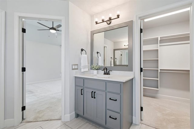 512 NW 186th St, Edmond, OK 73012 - bathroom with vanity, ceiling fan, and a spacious closet