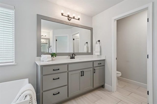512 NW 186th St, Edmond, OK 73012 - full bath featuring vanity, a freestanding tub, and a chandelier