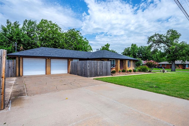 2100 Barclay Rd, Oklahoma City, OK 73120 - view of front of home with concrete driveway, an attached garage, and brick siding