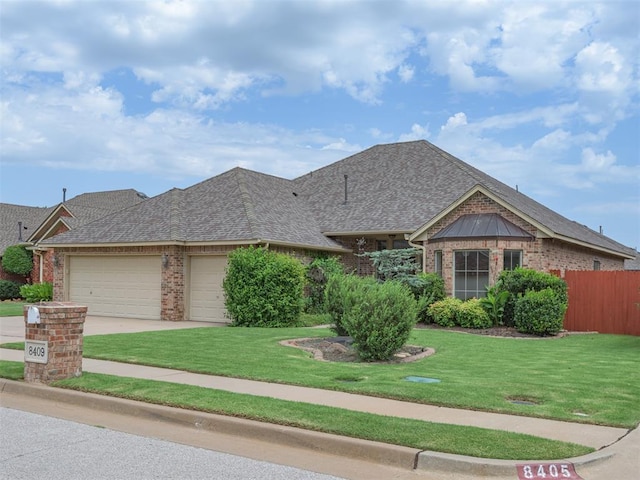 8409 NW 106th St, Oklahoma City, OK 73162 - view of front of property with brick siding, an attached garage, roof with shingles, and driveway