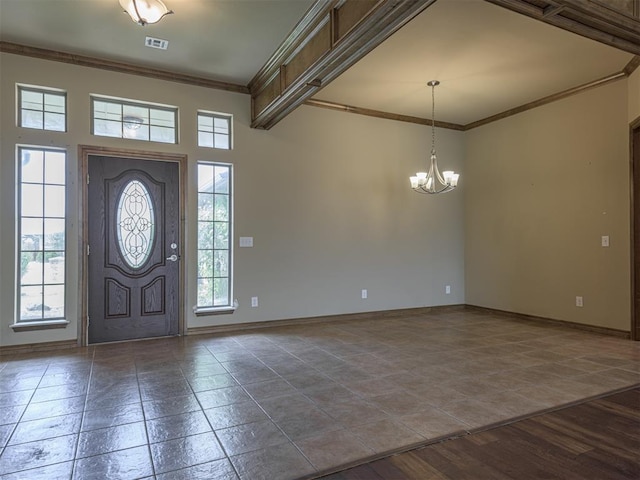 8409 NW 106th St, Oklahoma City, OK 73162 - tiled entryway with a chandelier, plenty of natural light, and crown molding