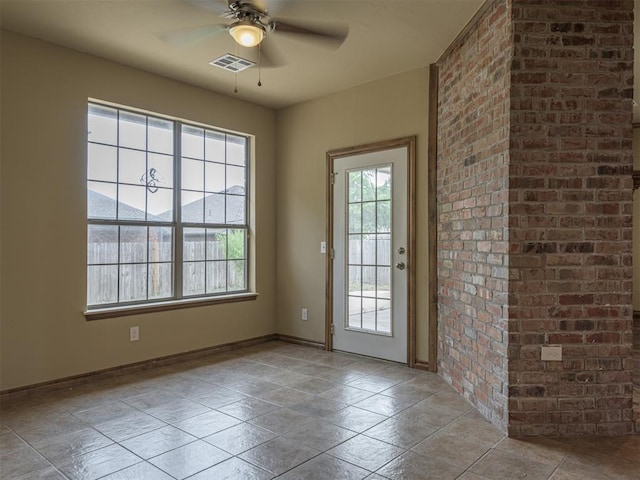 8409 NW 106th St, Oklahoma City, OK 73162 - doorway to outside with ceiling fan and baseboards