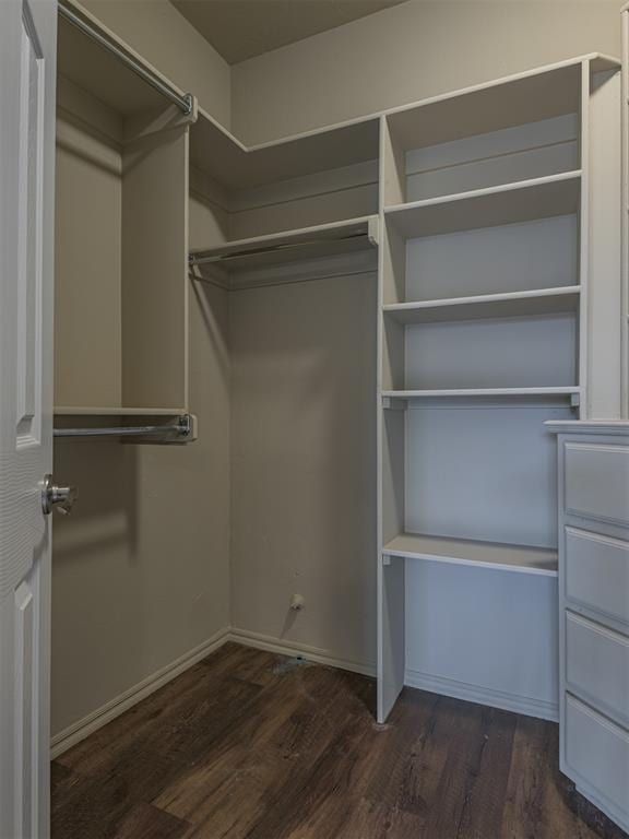 8409 NW 106th St, Oklahoma City, OK 73162 - walk in closet featuring wood finished floors