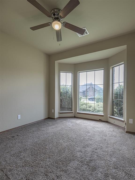 8409 NW 106th St, Oklahoma City, OK 73162 - carpeted spare room with baseboards and a ceiling fan