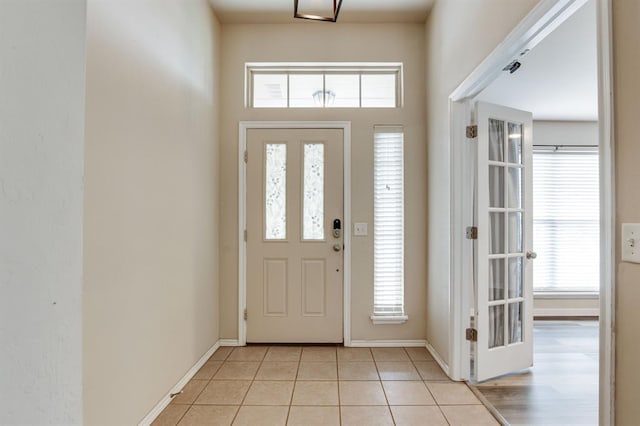 2113 SE 8th St, Moore, OK 73160 - entrance foyer featuring light tile patterned flooring and baseboards