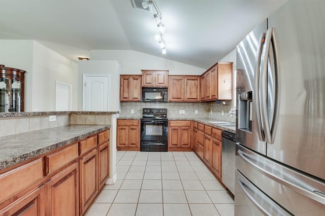 2113 SE 8th St, Moore, OK 73160 - kitchen with black appliances, lofted ceiling, light tile patterned floors, decorative backsplash, and rail lighting
