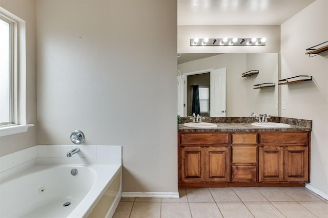 2113 SE 8th St, Moore, OK 73160 - bathroom featuring double vanity, tile patterned flooring, and a tub with jets