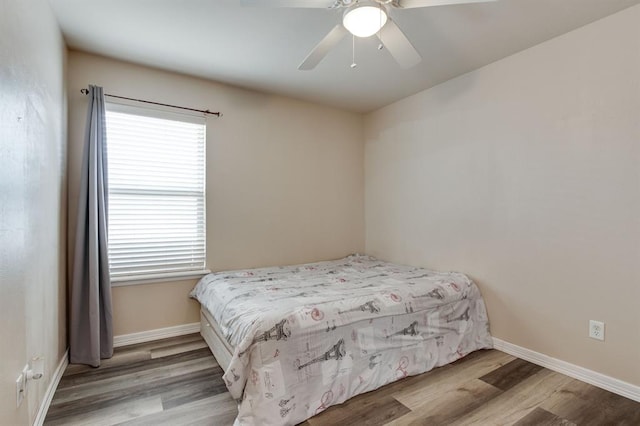 2113 SE 8th St, Moore, OK 73160 - bedroom featuring wood finished floors and ceiling fan