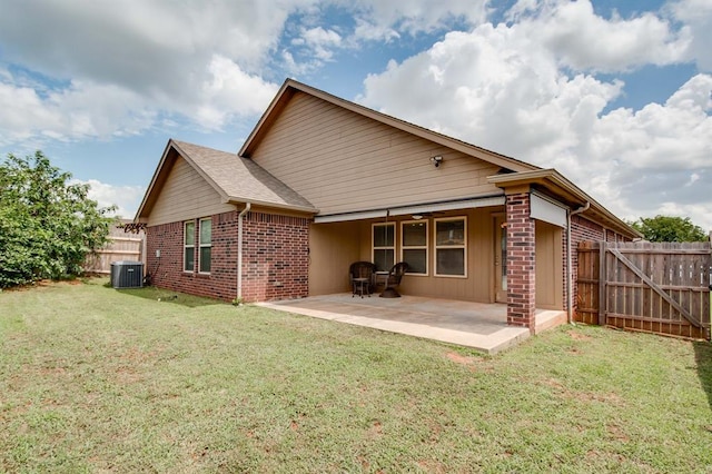 2113 SE 8th St, Moore, OK 73160 - back of house featuring a patio area and brick siding