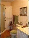 515 Logan Ave, Cashion, OK 73016 - full bathroom featuring vanity and a shower stall