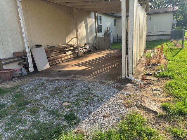 515 Logan Ave, Cashion, OK 73016 - view of patio featuring an attached carport and entry steps