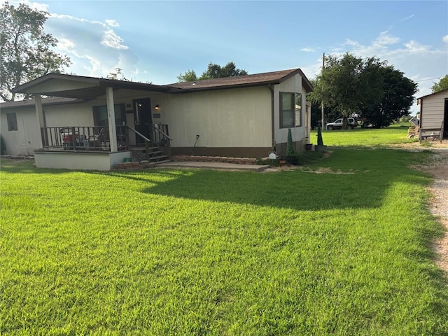 515 Logan Ave, Cashion, OK 73016 - rear view of house featuring a lawn and a porch