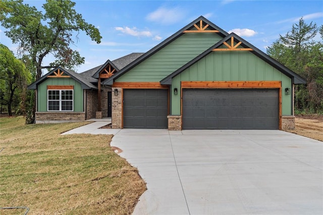 1244 Layla Ln, Blanchard, OK 73010 - view of front of home featuring an attached garage, a front yard, driveway, and board and batten siding