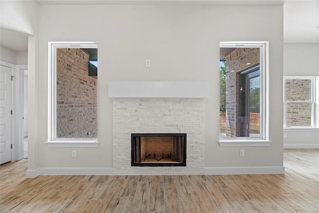 1244 Layla Ln, Blanchard, OK 73010 - unfurnished living room with wood finished floors and a fireplace