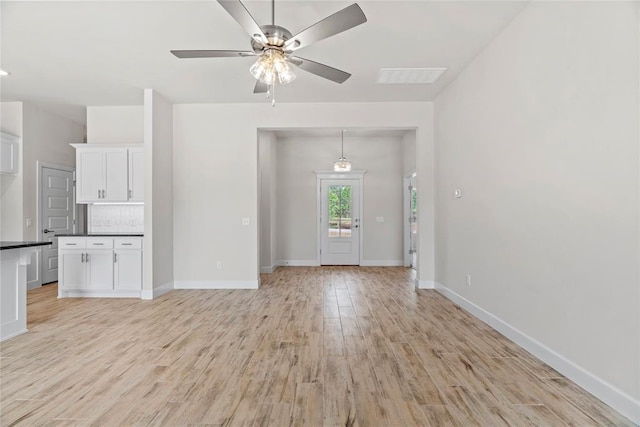 1244 Layla Ln, Blanchard, OK 73010 - unfurnished living room with light wood-type flooring and a ceiling fan