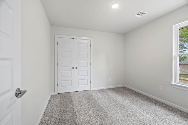 1244 Layla Ln, Blanchard, OK 73010 - unfurnished bedroom featuring carpet flooring and a closet