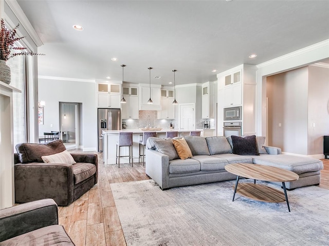 609 Newport Bridge Dr, Edmond, OK 73034 - living area with recessed lighting, crown molding, and light wood-type flooring