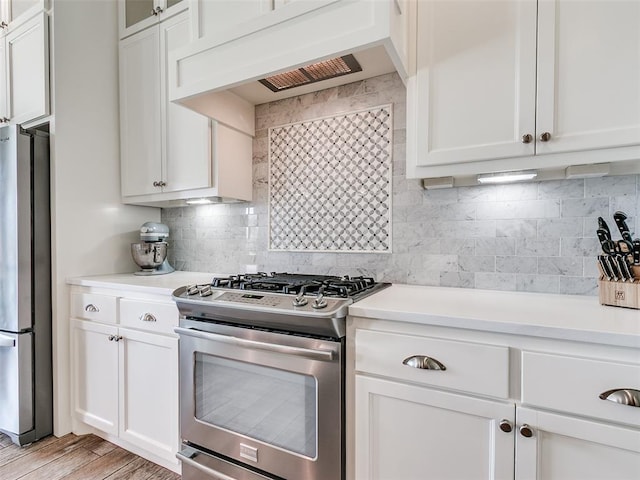 609 Newport Bridge Dr, Edmond, OK 73034 - kitchen with appliances with stainless steel finishes, custom exhaust hood, white cabinets, and light countertops