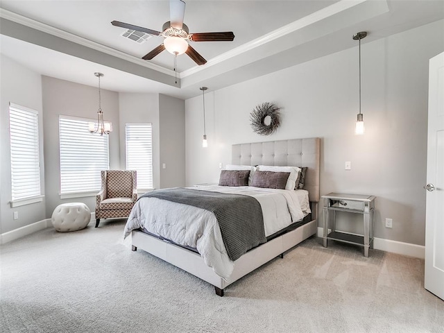609 Newport Bridge Dr, Edmond, OK 73034 - bedroom with ornamental molding, light carpet, a tray ceiling, a chandelier, and a ceiling fan