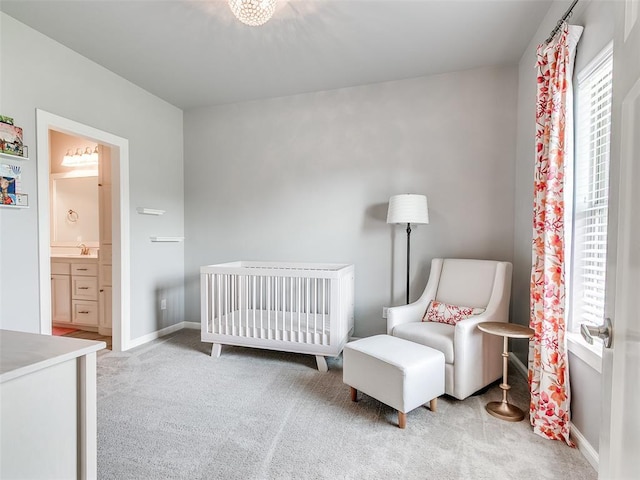 609 Newport Bridge Dr, Edmond, OK 73034 - carpeted bedroom with baseboards and a sink