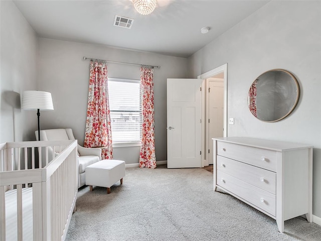 609 Newport Bridge Dr, Edmond, OK 73034 - bedroom with light colored carpet and a crib