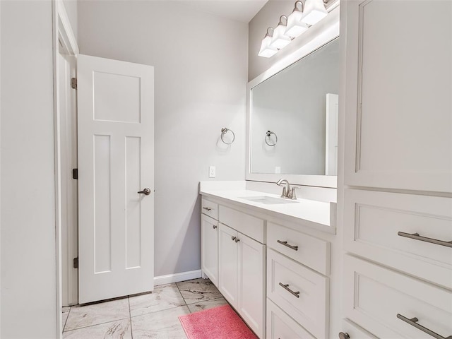 609 Newport Bridge Dr, Edmond, OK 73034 - bathroom featuring marble look tiles and vanity