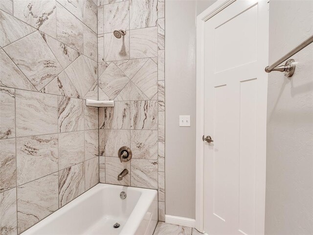 609 Newport Bridge Dr, Edmond, OK 73034 - bathroom featuring  shower combination and marble finish flooring
