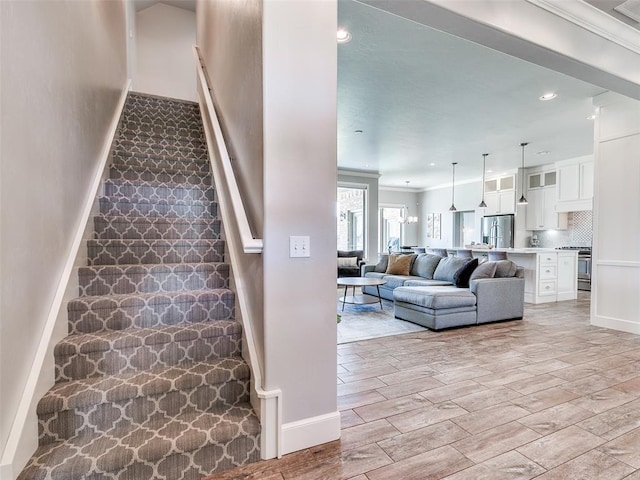 609 Newport Bridge Dr, Edmond, OK 73034 - staircase featuring ornamental molding, wood finish floors, and recessed lighting