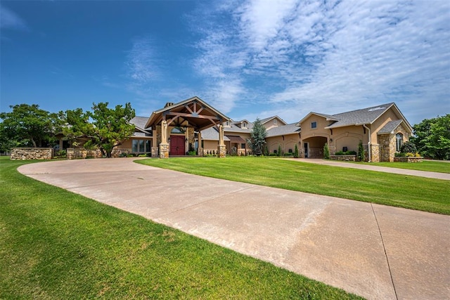 1701 Woodhill Rd, Edmond, OK 73025 - craftsman house featuring stone siding, a front yard, and stucco siding