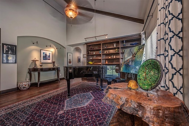 1701 Woodhill Rd, Edmond, OK 73025 - office area with high vaulted ceiling, wood finished floors, beam ceiling, a ceiling fan, and arched walkways