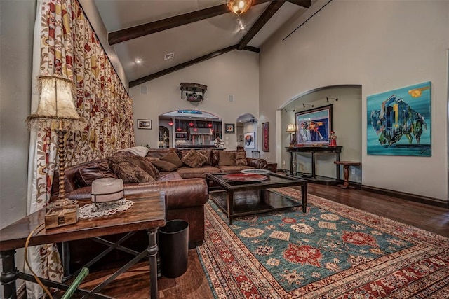 1701 Woodhill Rd, Edmond, OK 73025 - living area with beamed ceiling, wood finished floors, and high vaulted ceiling