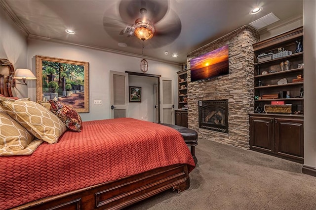 1701 Woodhill Rd, Edmond, OK 73025 - bedroom featuring carpet floors, crown molding, a fireplace, recessed lighting, and a ceiling fan