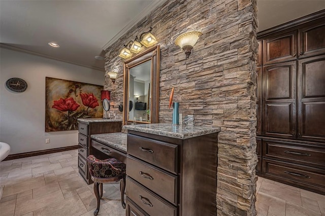 1701 Woodhill Rd, Edmond, OK 73025 - full bath with ornamental molding, vanity, and stone finish floors