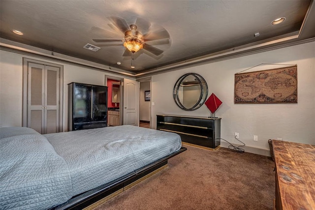 1701 Woodhill Rd, Edmond, OK 73025 - carpeted bedroom featuring freestanding refrigerator, crown molding, ceiling fan, a closet, and recessed lighting