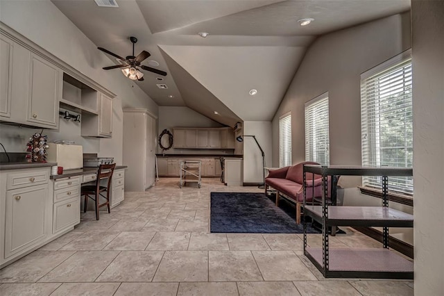 1701 Woodhill Rd, Edmond, OK 73025 - interior space with plenty of natural light, ceiling fan, vaulted ceiling, built in desk, and recessed lighting