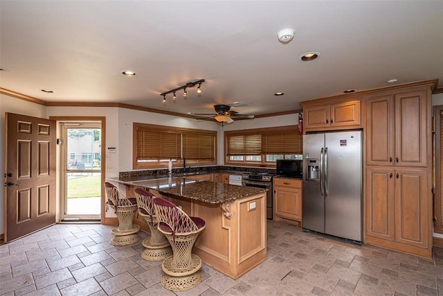 1701 Woodhill Rd, Edmond, OK 73025 - kitchen featuring stainless steel refrigerator with ice dispenser, range with electric stovetop, black microwave, stone tile flooring, and ornamental molding