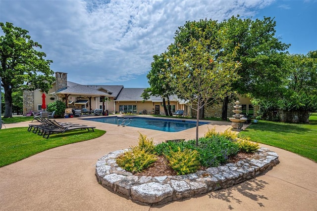 1701 Woodhill Rd, Edmond, OK 73025 - view of swimming pool with a yard and a patio area