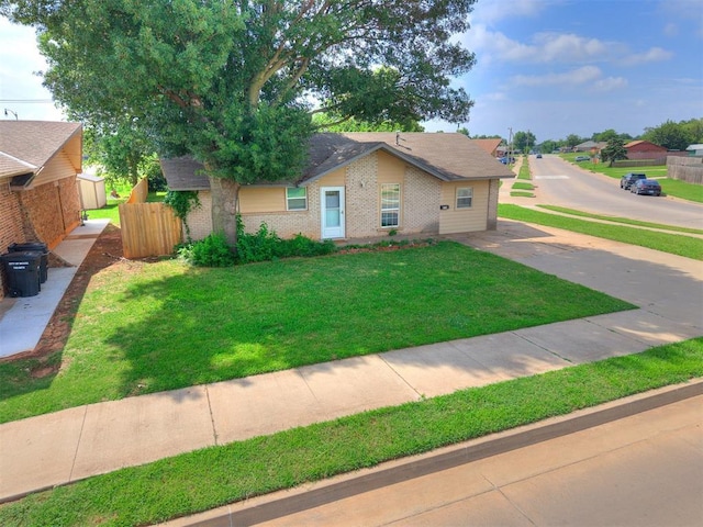 650 NW 5th St, Moore, OK 73160 - view of front facade with brick siding and driveway