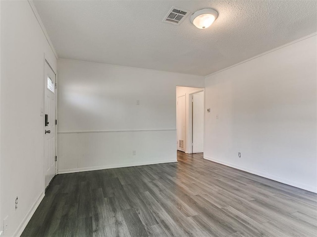 650 NW 5th St, Moore, OK 73160 - unfurnished room featuring wood finished floors, ornamental molding, and a textured ceiling