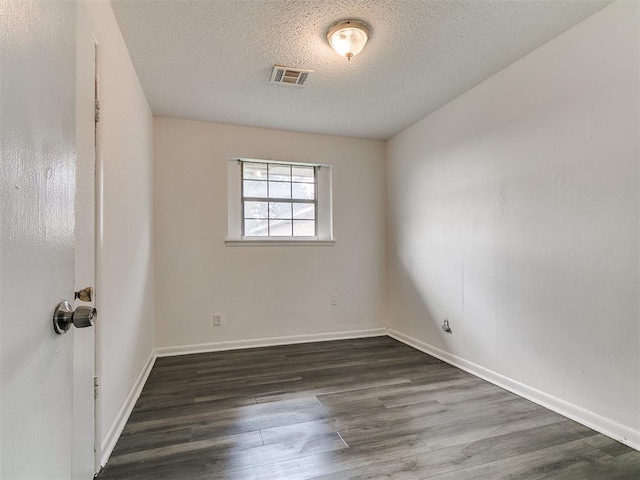 650 NW 5th St, Moore, OK 73160 - empty room with a textured ceiling and wood finished floors